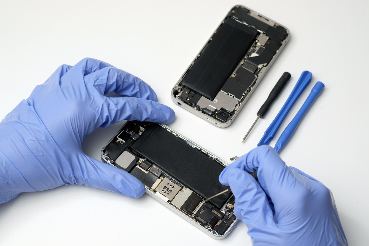 Technician repairing the Cell phone parts and tools for recovery repair phone smartphone