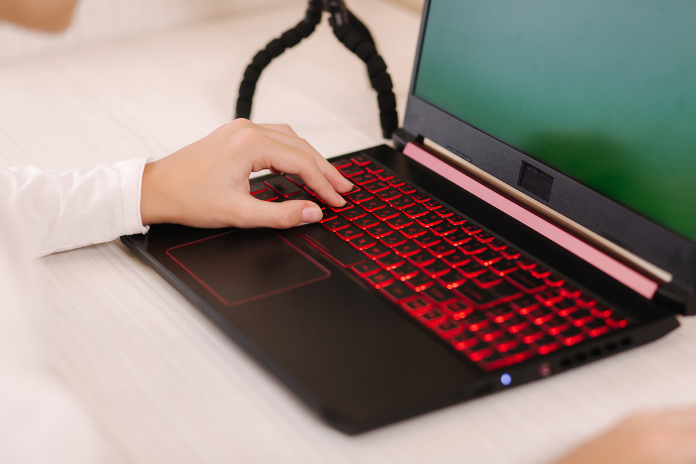 Person Using Laptop on Table