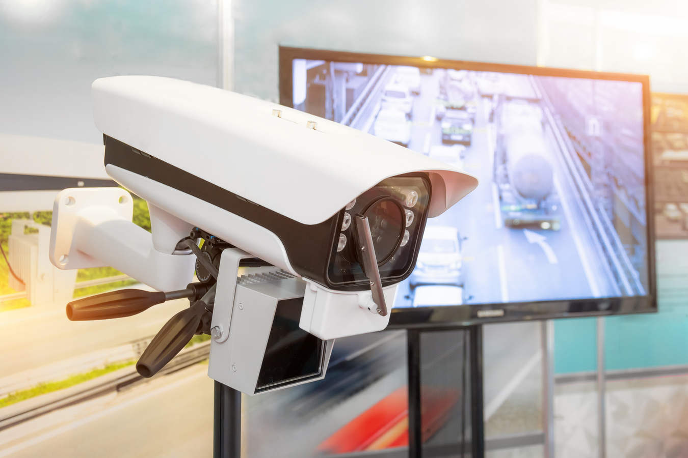 Traffic security camera surveillance CCTV on the road in the big city.